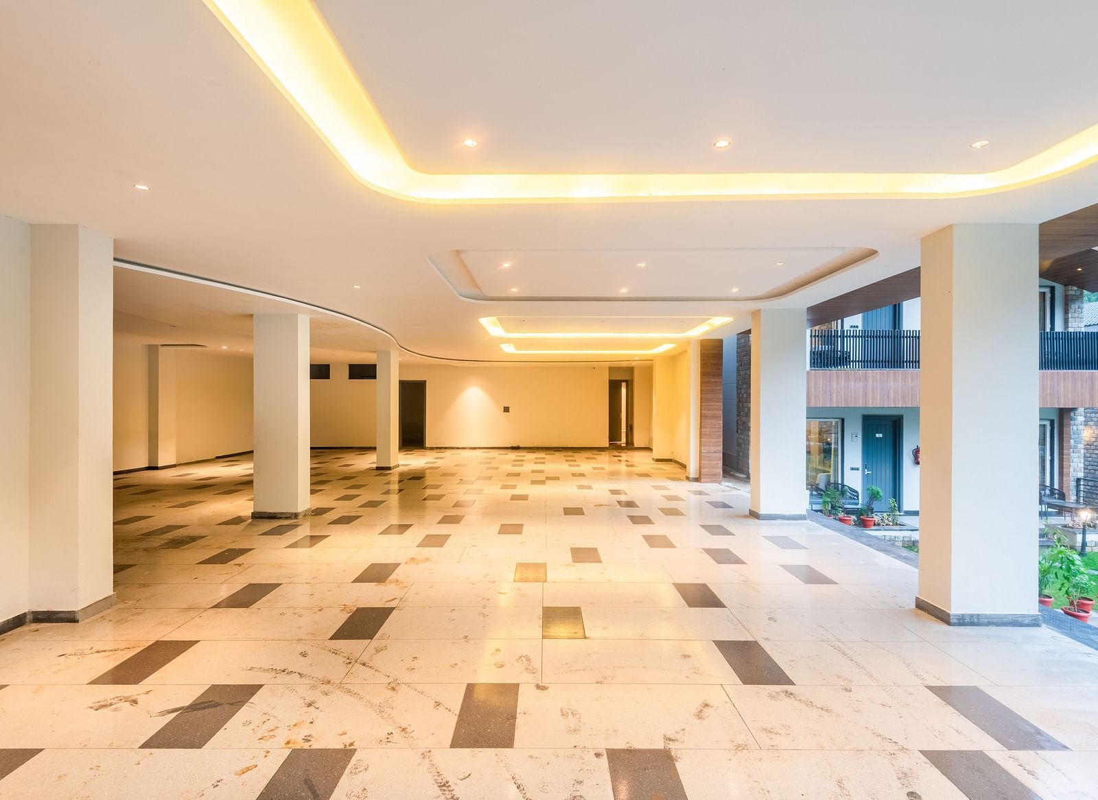 Spacious Parking at DLS Divine River Resort and Spa with warm lighting